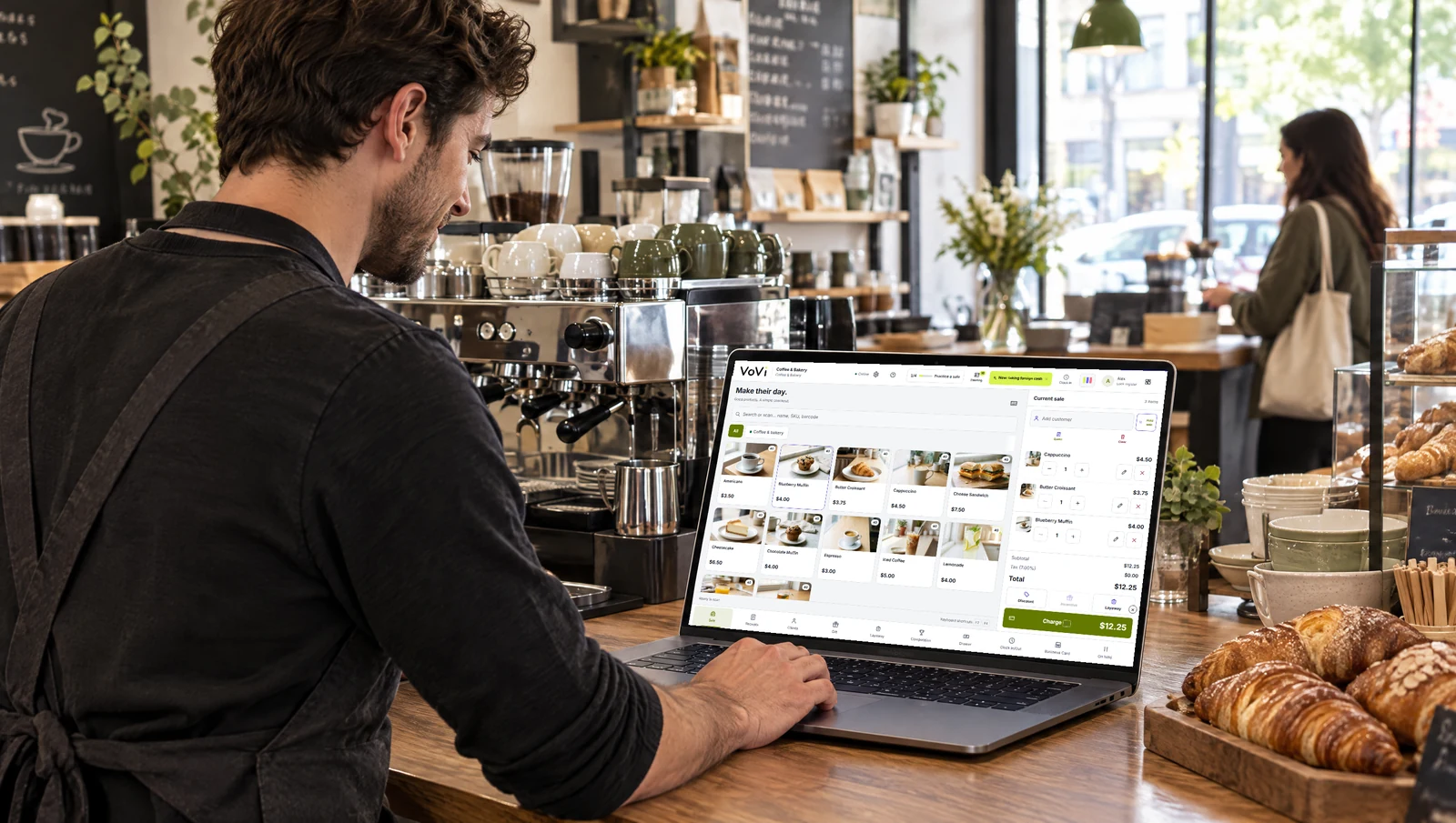 VoVi sales screen with coffee and pastry product photos on a café laptop.